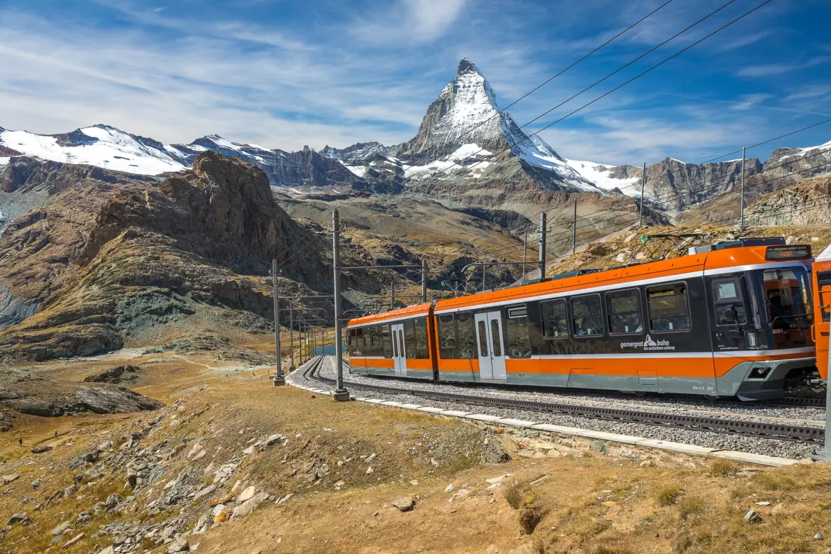 A Gornergrat Railway train on its way up with the Matterhorn behind