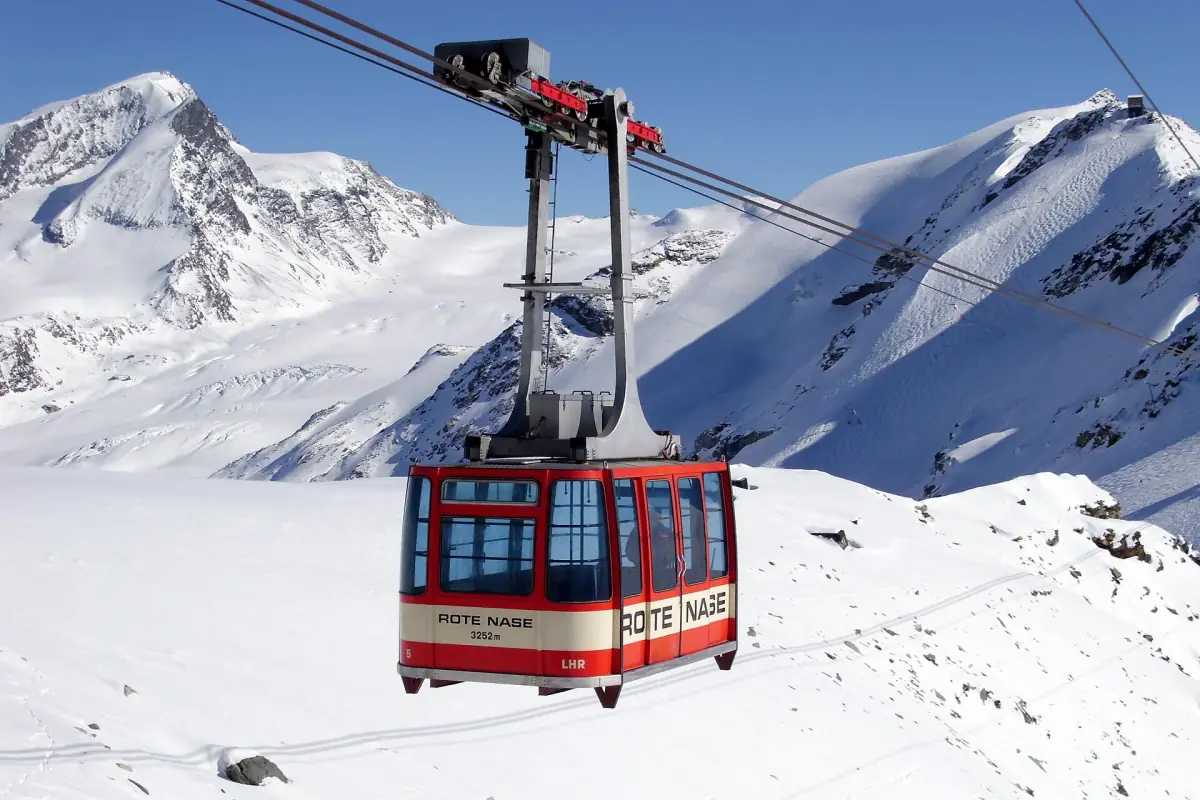 A cable car above snowy slopes in the Zermatt ski area
